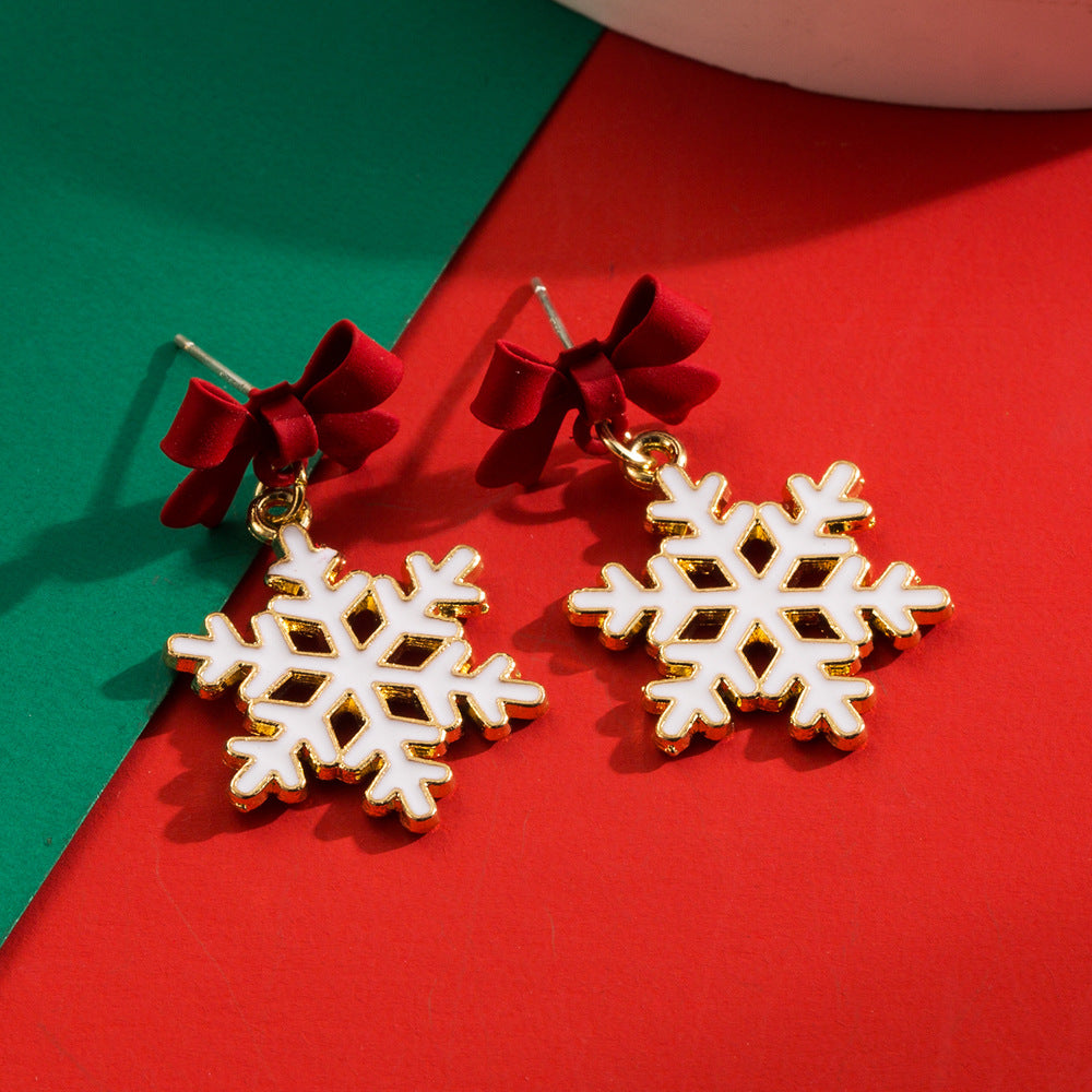 Women's Hollow Snowflake Bow Drop Oil Ear Earrings