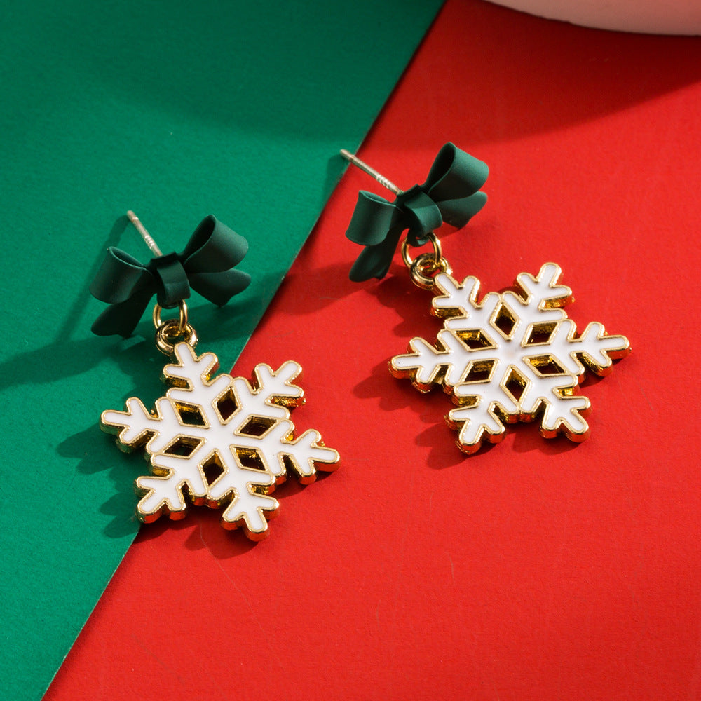 Women's Hollow Snowflake Bow Drop Oil Ear Earrings