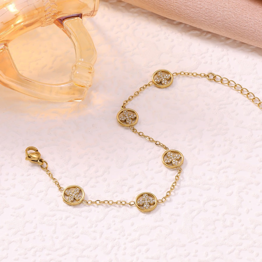 Women's Luxury Diamond Studded Hollow Four-leaf Flower Fashion Vacuum Electroplating Stainless Bracelet