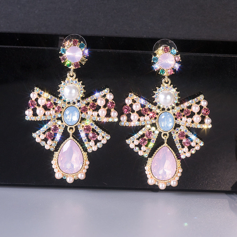 Women's Pink High Profile Fashion Hollow Pearl Earrings