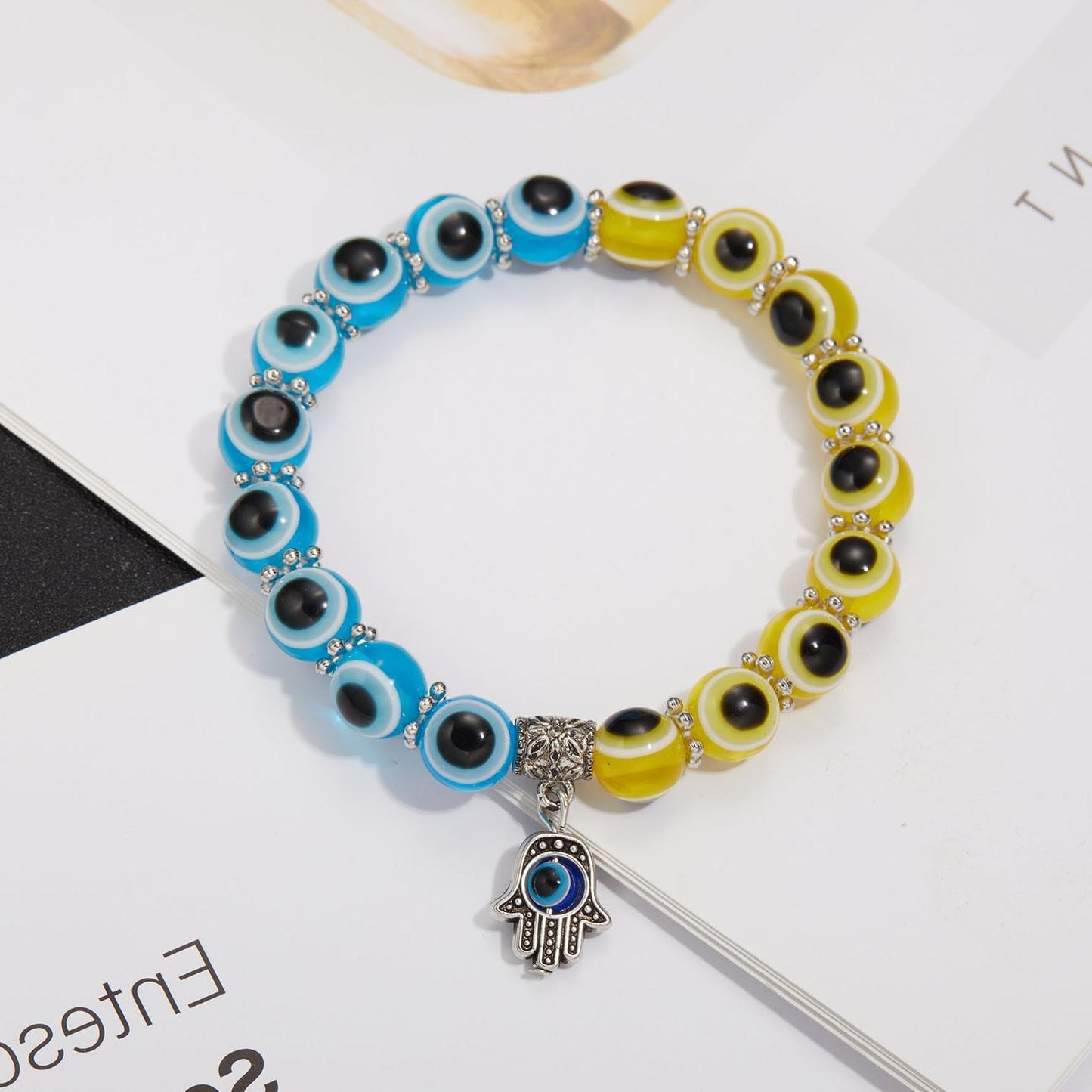Alloy Palm Hollow Blue Eyes Beaded Elastic Bracelet