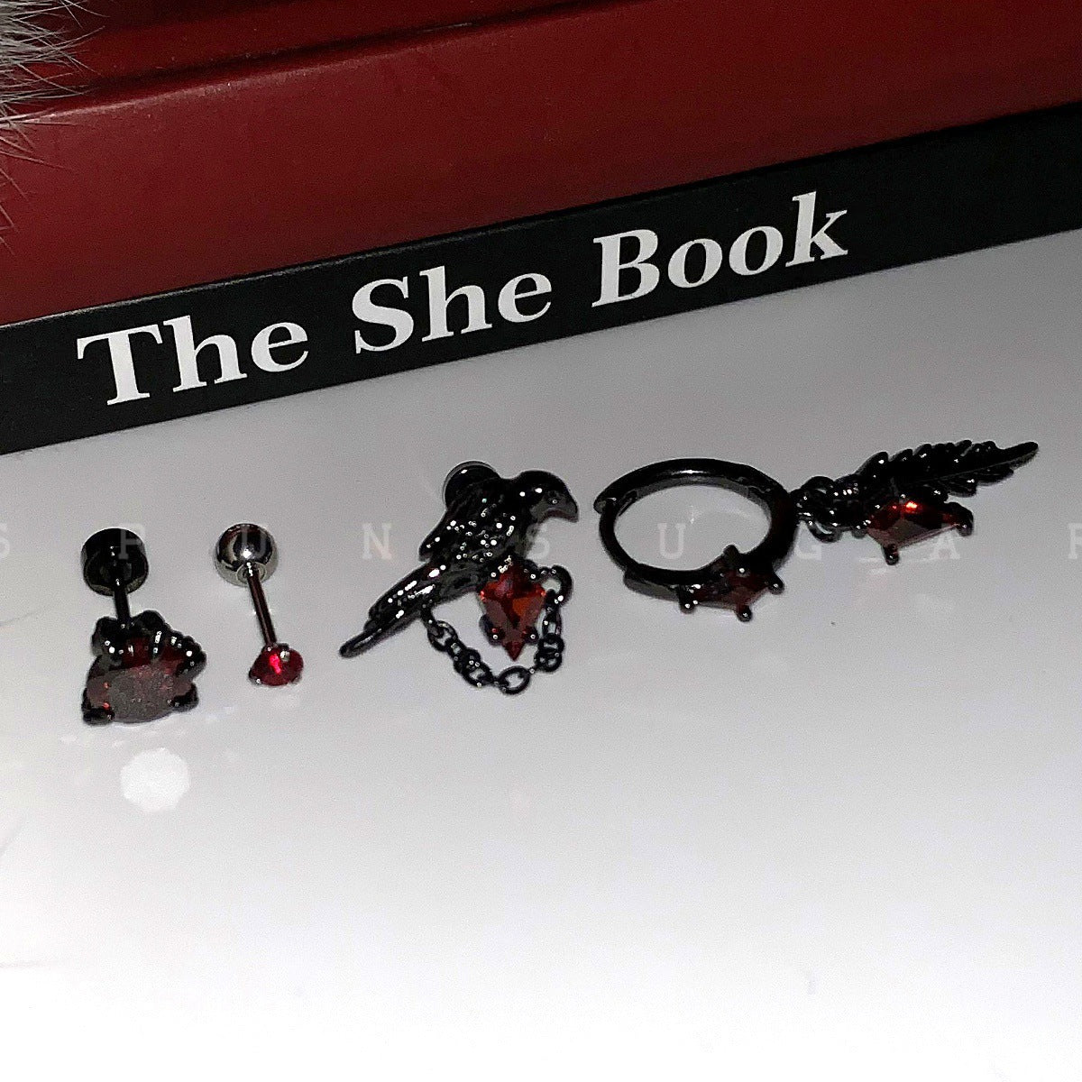 Crow Black Ear Bone Titanium Steel Screw Red Zircon Rings