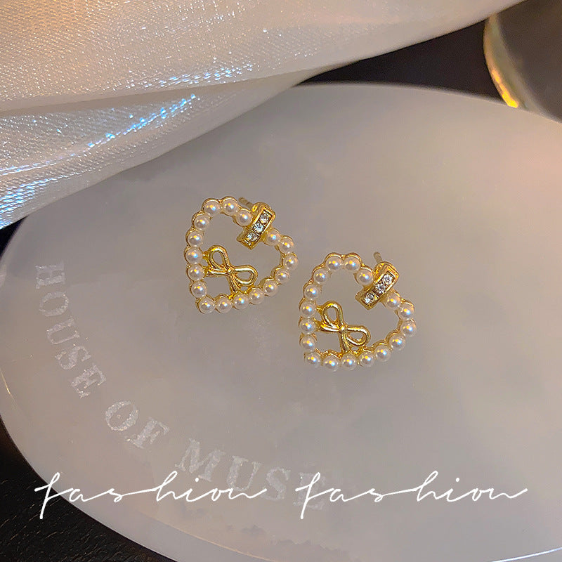 Sier Needle Hollow Love Heart Bow Tie Pearl Lady Joker Earrings