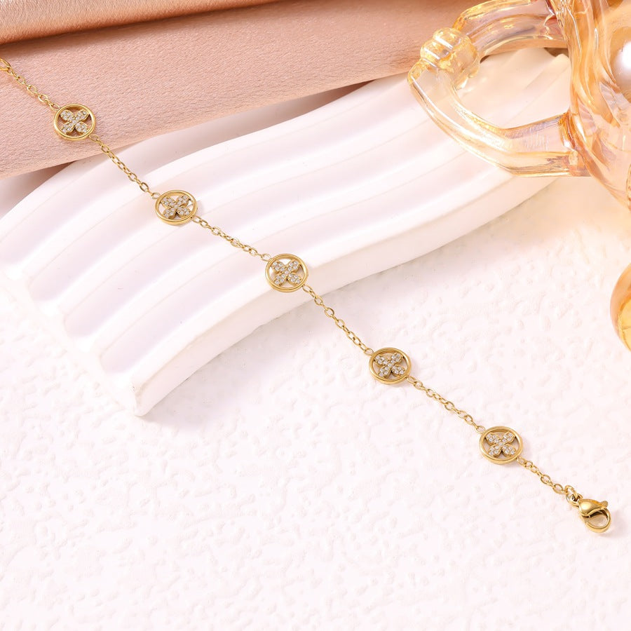 Women's Luxury Diamond Studded Hollow Four-leaf Flower Fashion Vacuum Electroplating Stainless Bracelet