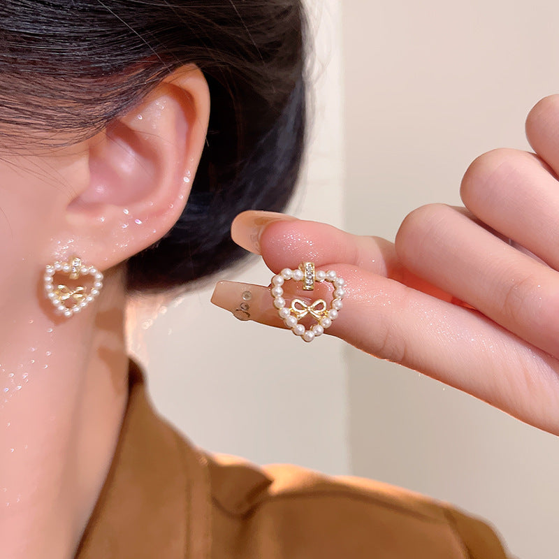 Sier Needle Hollow Love Heart Bow Tie Pearl Lady Joker Earrings