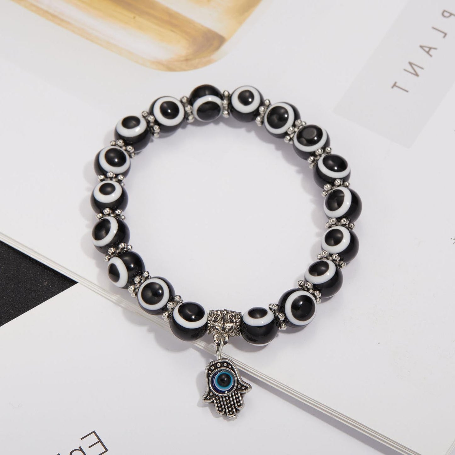 Alloy Palm Hollow Blue Eyes Beaded Elastic Bracelet