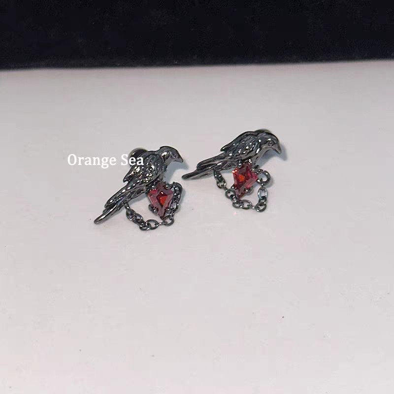 Crow Black Ear Bone Titanium Steel Screw Red Zircon Rings
