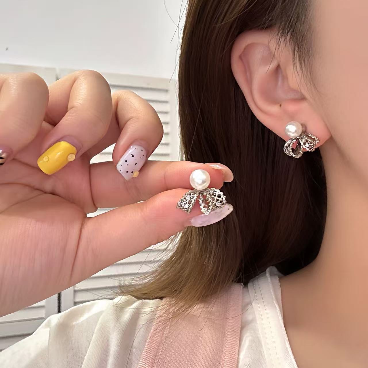 Hollow Bow Pearl Female Fashion High Sense Bud Stud Earrings