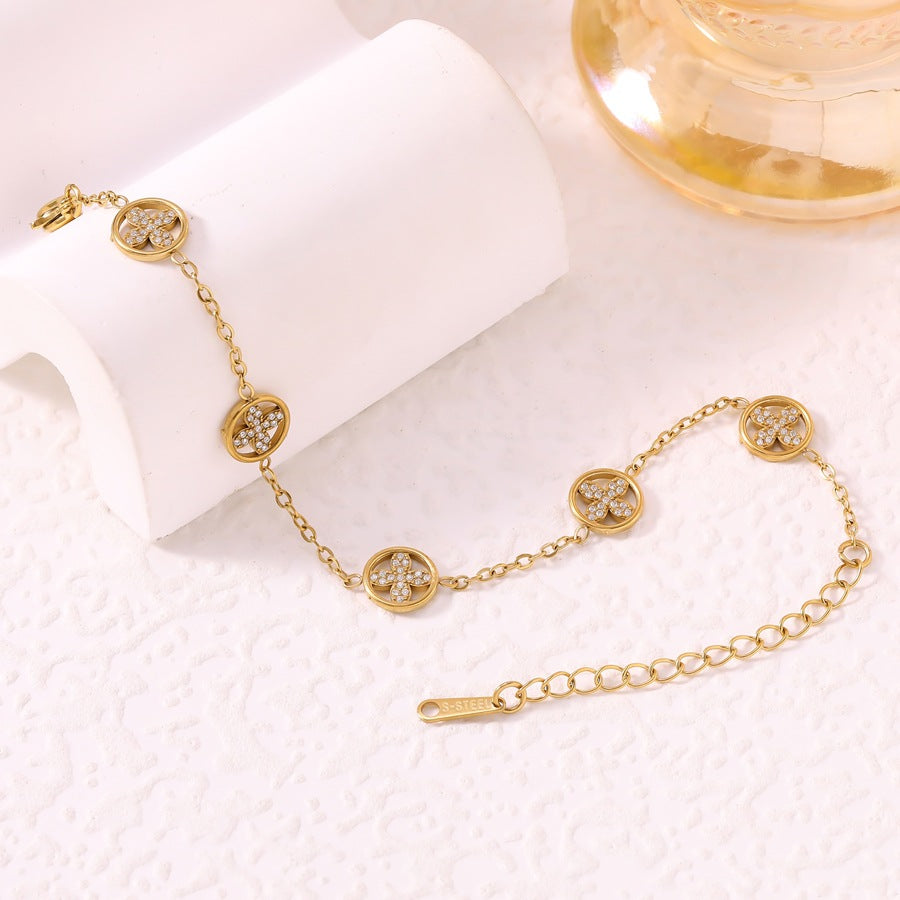 Women's Luxury Diamond Studded Hollow Four-leaf Flower Fashion Vacuum Electroplating Stainless Bracelet