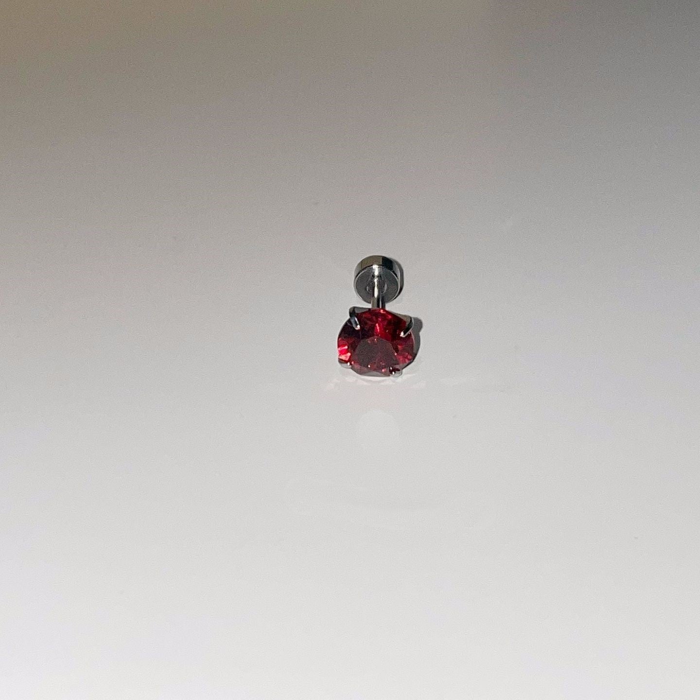Crow Black Ear Bone Titanium Steel Screw Red Zircon Rings