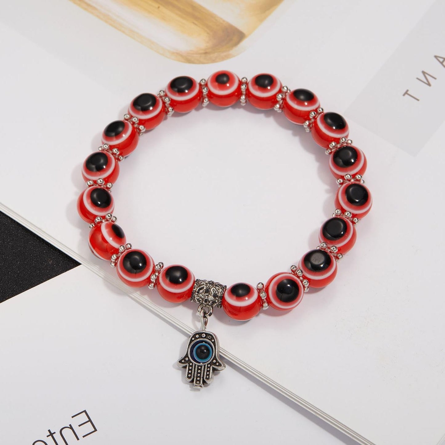 Alloy Palm Hollow Blue Eyes Beaded Elastic Bracelet