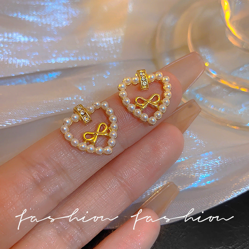 Sier Needle Hollow Love Heart Bow Tie Pearl Lady Joker Earrings