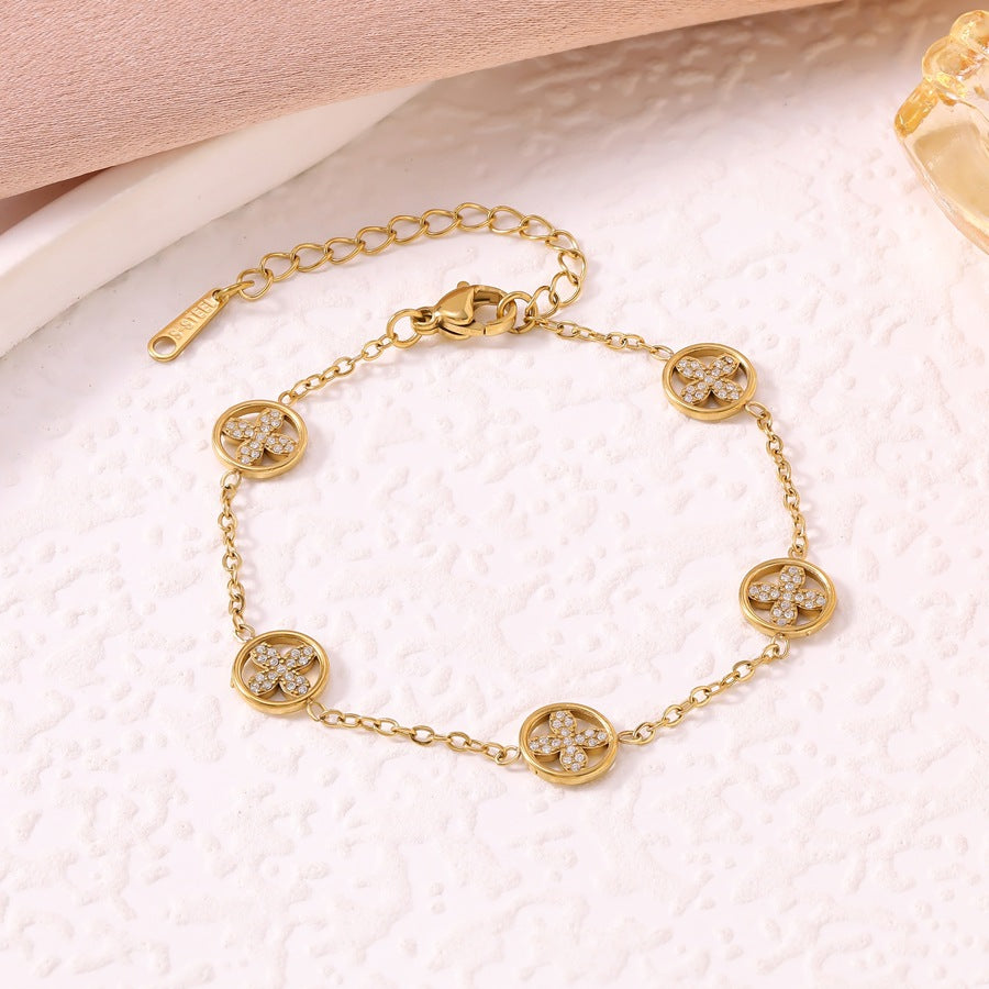 Women's Luxury Diamond Studded Hollow Four-leaf Flower Fashion Vacuum Electroplating Stainless Bracelet