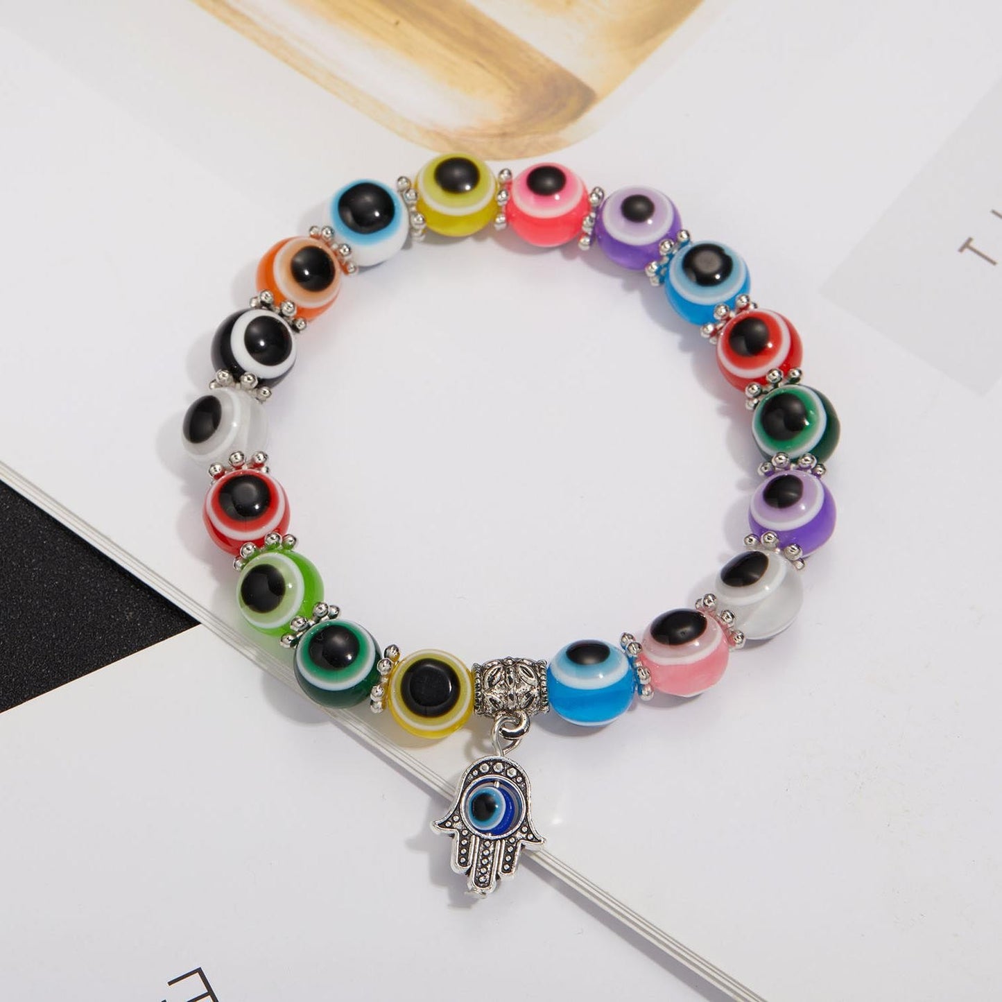 Alloy Palm Hollow Blue Eyes Beaded Elastic Bracelet
